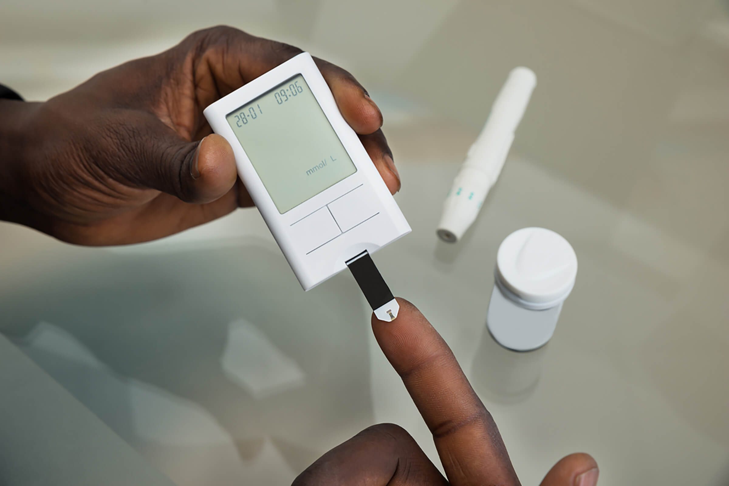 checking blood glucose with finger prick