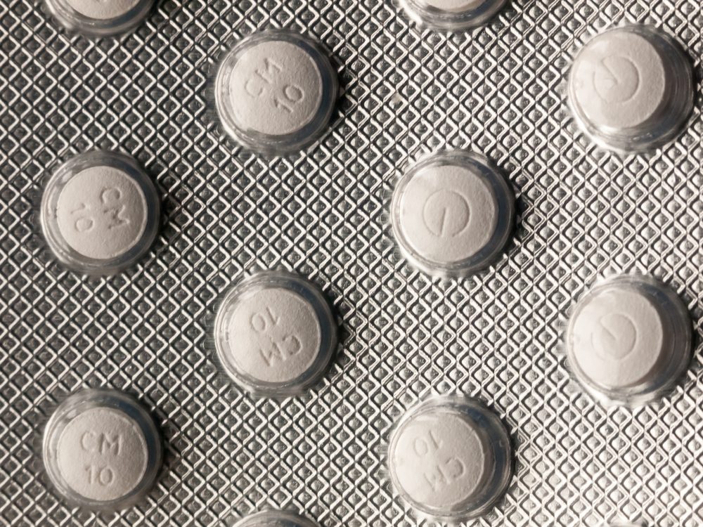 close up of back of foil tablet packet white pills; essex; england; uk