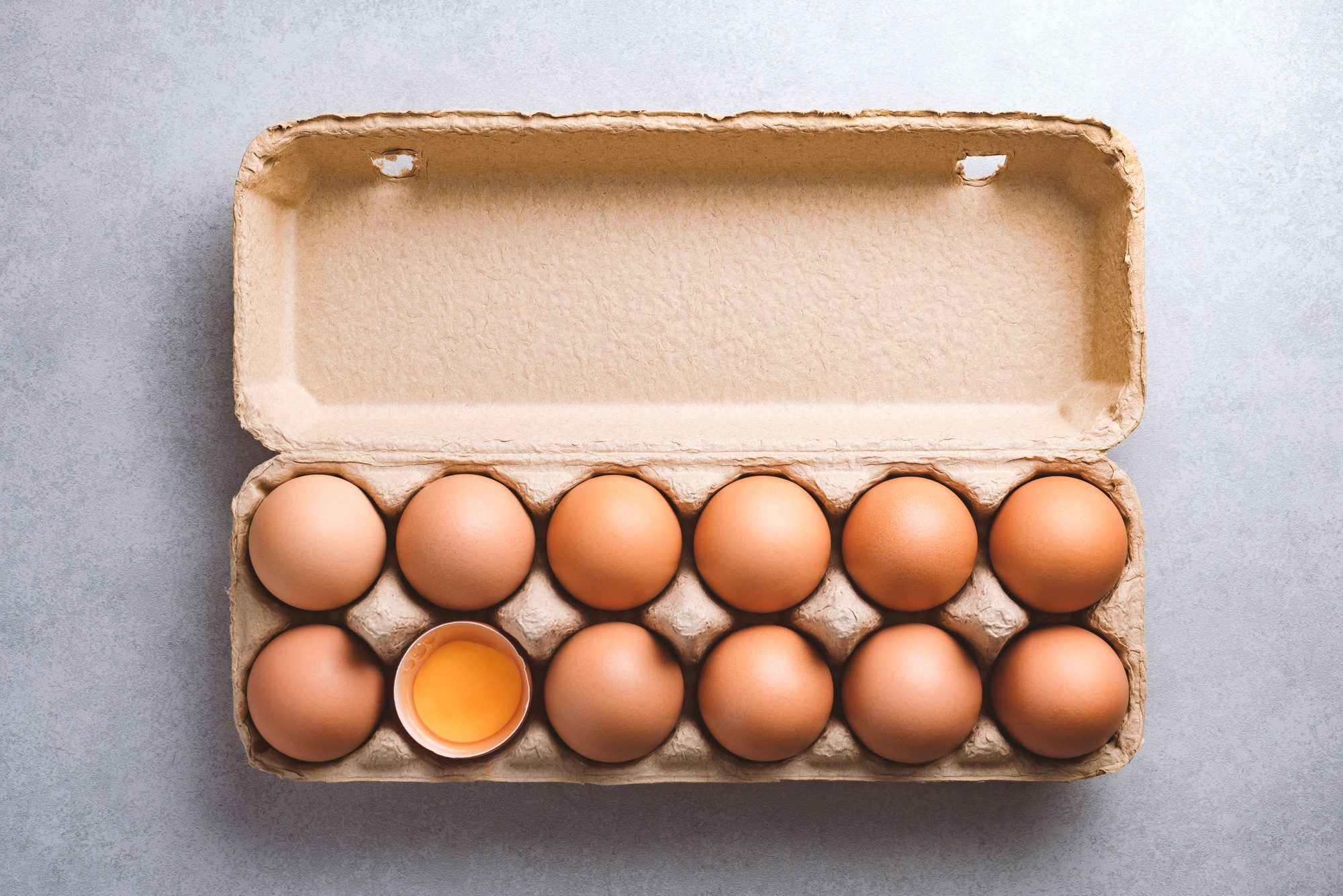 Organic chicken eggs in a carton on a kitchen counter