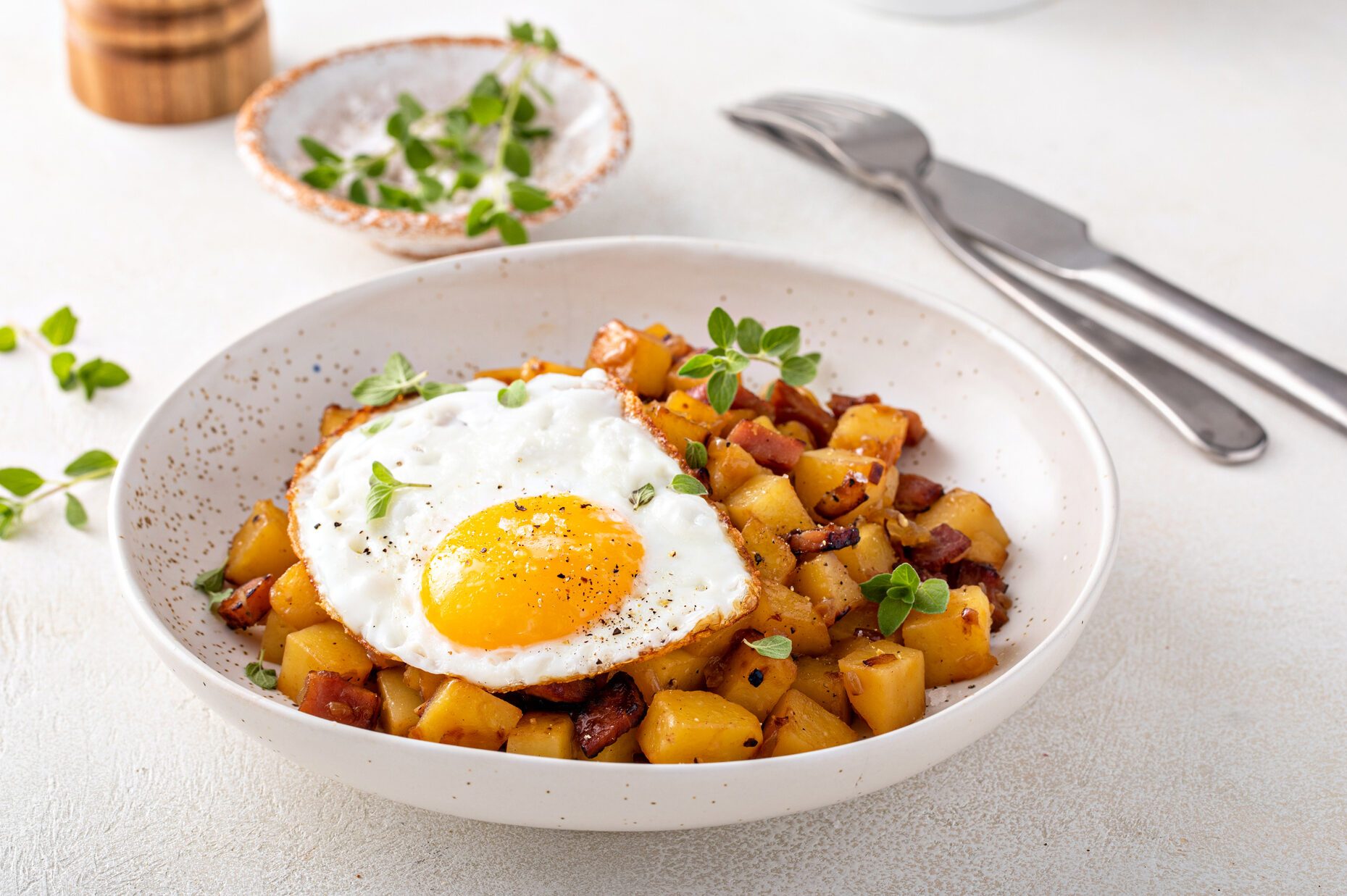 Potato, onion and ham hash topped with fried egg
