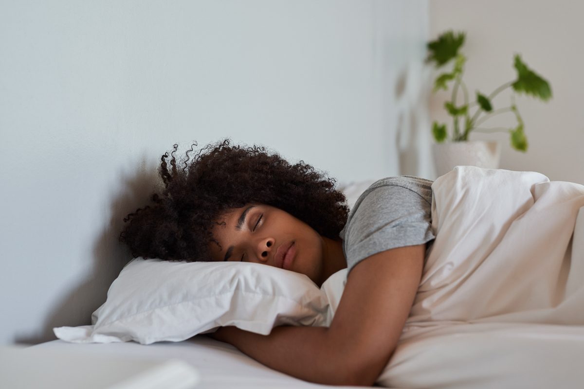 woman sleeping in her bed