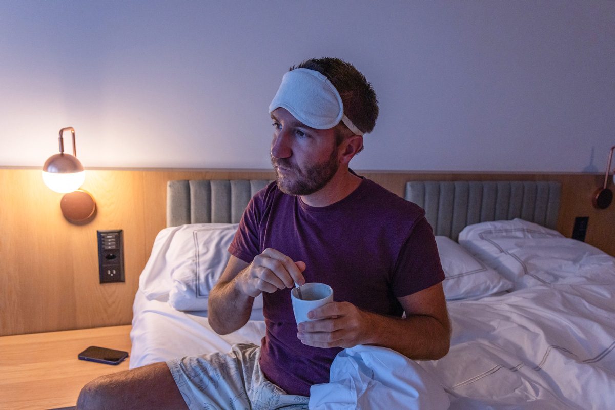 man drinking herbal tea before going to bed