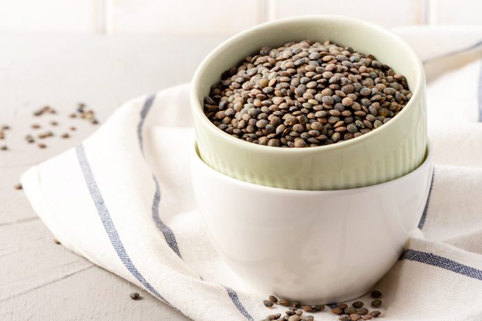 Dry uncooked green lentils.