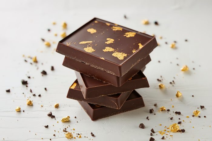 A photo of a stack of dark chocolate bars