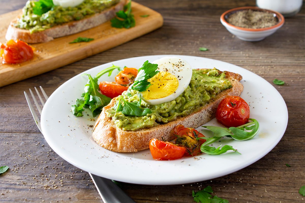 Lemon Smashed Avocado Toast With Fried Egg Gettyimages 1311507085